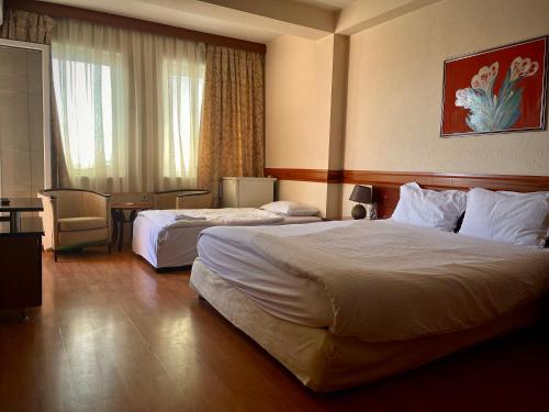Postel nebo postele na pokoji v ubytování Hotel Ilinden