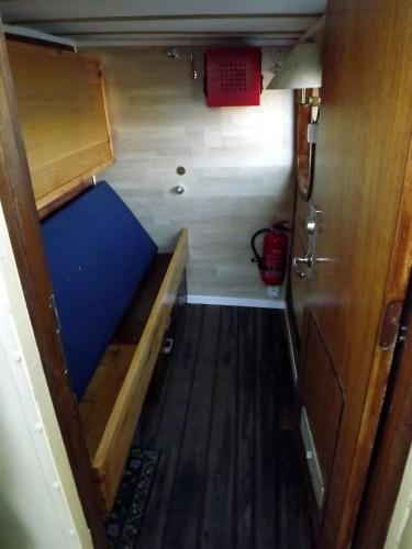 an interior view of a small room with a blue floor at Ship Windö in Södertälje