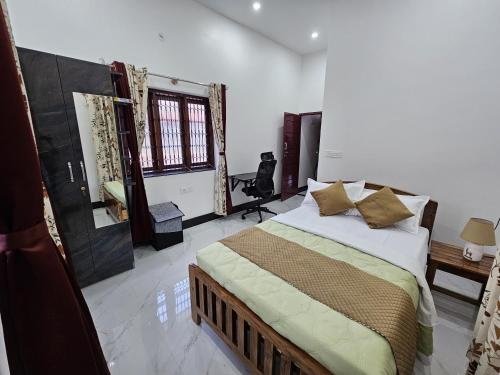 a bedroom with a large bed in a room at Aho Havens in Bengaluru