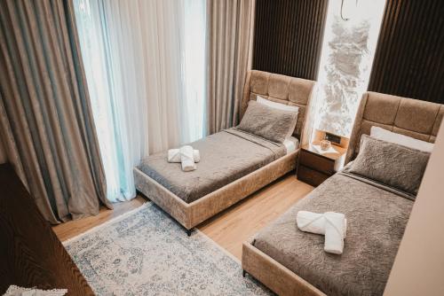 Ένα ή περισσότερα κρεβάτια σε δωμάτιο στο Sino Boutique Hotel