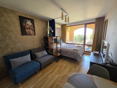 a living room with a couch and a table at Golden Lady in Sveti Vlas