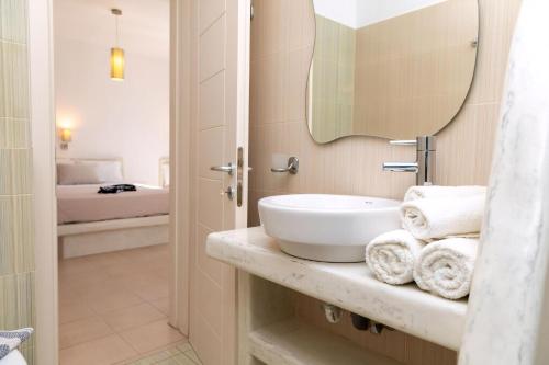 a bathroom with a sink and a mirror at Naxos Central Room Superior Triple Room Balcony 200M From St George Beach City Views Saint George in Naxos Chora