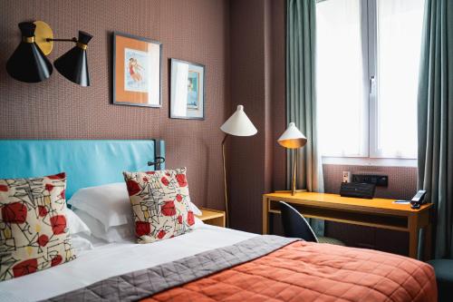Postel nebo postele na pokoji v ubytování Hôtel Artus