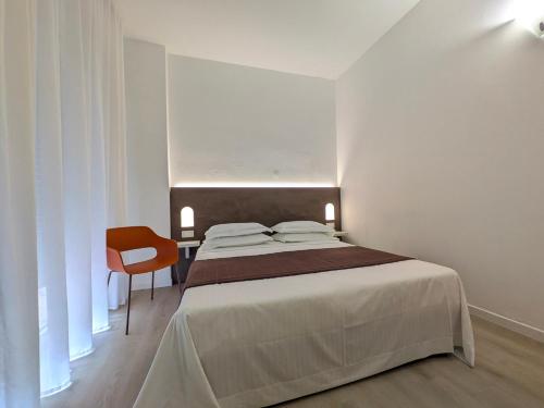 Postel nebo postele na pokoji v ubytování Hotel Piccolo
