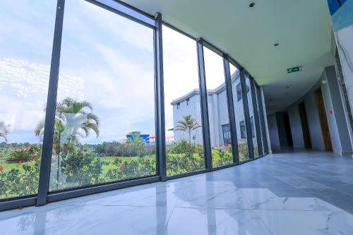 an empty room with large windows in a building at Aquarius Kigo Resort in Kigo
