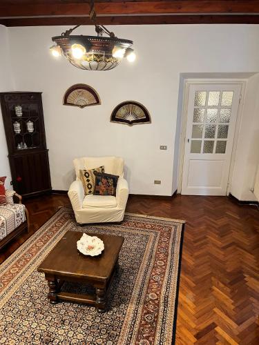 a living room with a couch and a coffee table at Rifugio Rustico con Vista sulle Colline Toscane in Settignano
