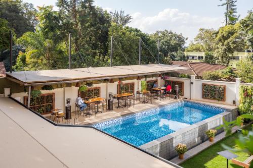 an aerial view of a house with a swimming pool at The Social House Nairobi, a Preferred Lifestyle Hotel in Nairobi