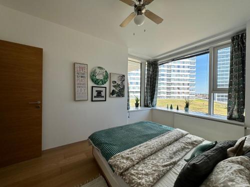 Ένα ή περισσότερα κρεβάτια σε δωμάτιο στο 2 apartments in 1 building