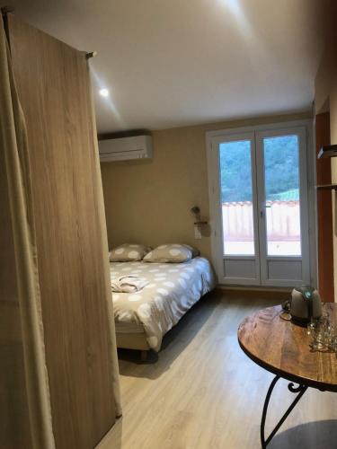 Ένα ή περισσότερα κρεβάτια σε δωμάτιο στο Auberge De La Vallee