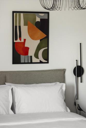 Ένα ή περισσότερα κρεβάτια σε δωμάτιο στο Babylon Luxury Suites No1 by BiNoBi!