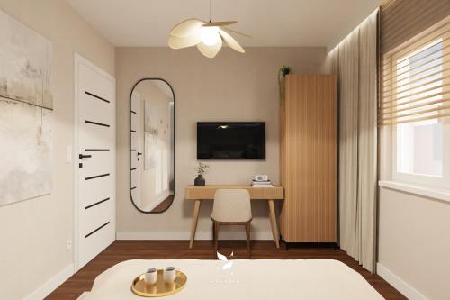a living room with a desk and a mirror at Mużakowski Forest Retreat - rezydencja z basenem in Bronowice