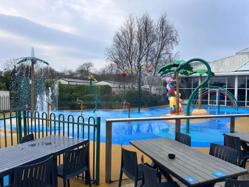 a swimming pool with a water park with a playground at Haven Cala gran 2026 spring summer autumn winter breaks up to January 2027 A full action camp for all ages disabled friendly Fleetwood Blackpool Entire home 6 people seaside caravan park in Fleetwood