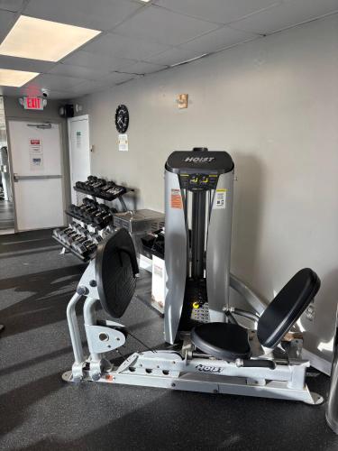 a gym with a treadmill and treadmills at Ocean View Studio Wkitchen On Sunny Isles Beach! in Sunny Isles Beach