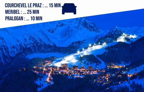 a view of a town on a mountain at night at Localisation centrale et vue spectaculaire in Champagny-en-Vanoise