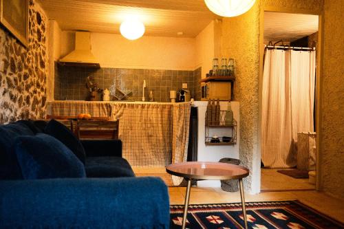 a living room with a couch and a table at CASA MIA - Maison et chambres à louer à Corbara in Corbara