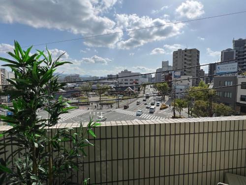 a view of a city with cars on a road at stay papiyon 博多 in Fukuoka