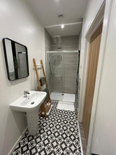 a bathroom with a sink and a shower at Apartment - Poole High Street in Poole