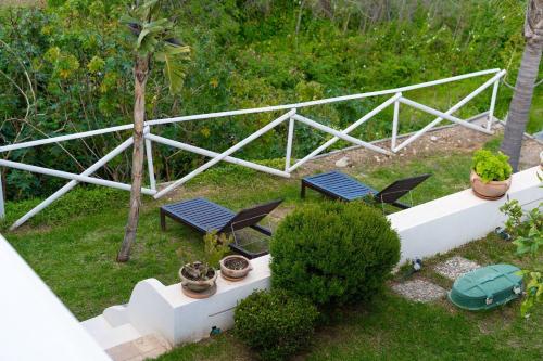 an aerial view of two chairs and a table at Villa Zagara Garden Spectacular Sea View in Taormina in Taormina