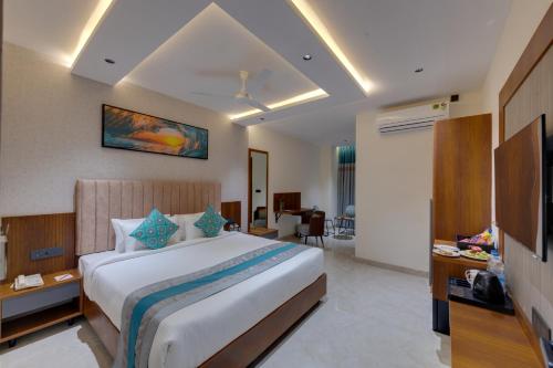 a bedroom with a large bed in a room at Click Hotel Shamshabad - Hyderabad Airport in Hyderabad