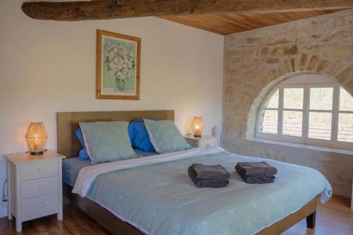 Postel nebo postele na pokoji v ubytování La Tannerie - St Antonin Noble Val