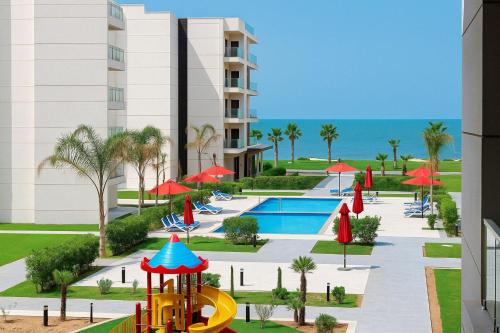 a view of the pool at the resort with a playground at Private Chalet with Relaxing Outdoor Area in Port Said