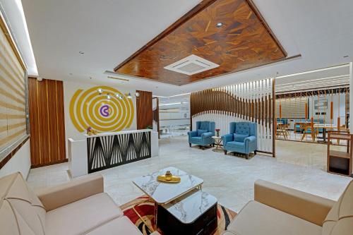 a lobby with couches and chairs and a table at Click Hotel Shamshabad - Hyderabad Airport in Hyderabad