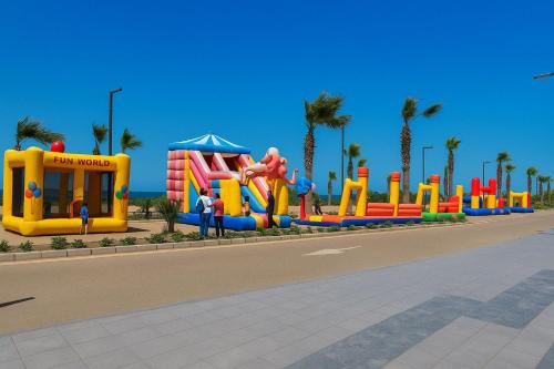 a playground in a park with a water park at Private Chalet with Relaxing Outdoor Area in Port Said