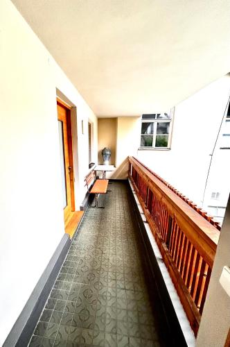 an empty hallway with a staircase in a house at Mitte Apartments in Brno