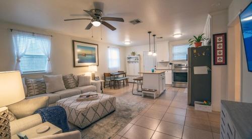 a living room with a couch and a table at 2bd-2ba Adorable Home w Yard in Gentilly in New Orleans