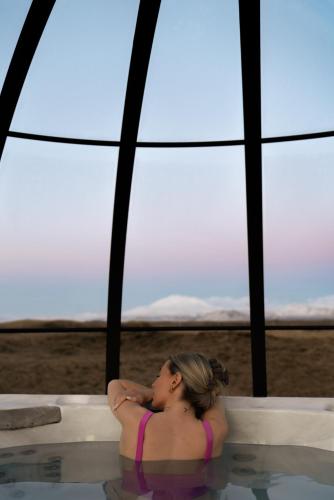 a woman sitting in a pool of water at Landhotel in Hella