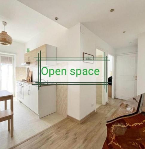 a kitchen with a sign that reads open space at Vacanze romane in Rome