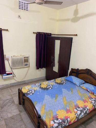 Ένα ή περισσότερα κρεβάτια σε δωμάτιο στο Moushumi's Home - 2 Bedrooms - Pet Friendly