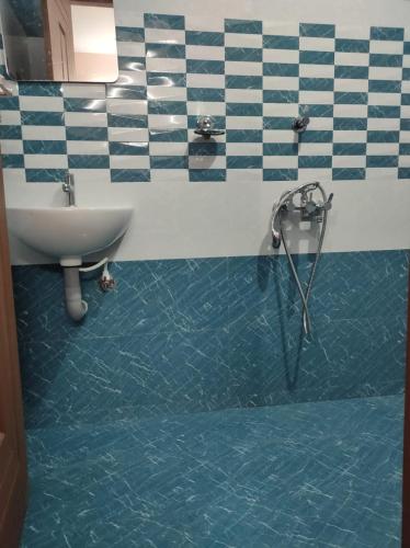 a bathroom with a shower and a sink in a bathroom at VILLA VISTA Apt RENTAL in Alleppey