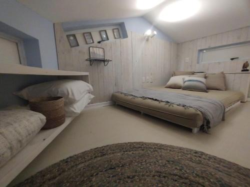 a bedroom with two beds in a room at Apartamento Triplex Boutique - 39JurereByTheSea in Florianópolis