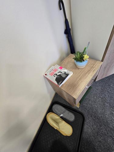 a small wooden table with ainylinylinylinylinylinylinylinylinylinyl at MA DONNA rooms in Floreşti