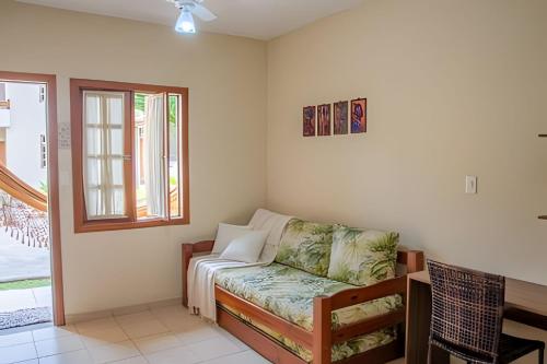 En eller flere senge i et værelse på em frente à PRAIA de Taperapuan; piscina; 1 quarto; WiFi 300 mbs; Estacionamento Gratuito 1 veículo