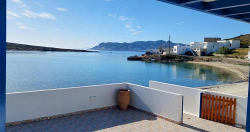a balcony with a view of a body of water at Harmonia Beach House in Kimolos