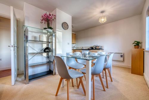 a kitchen with a table and chairs and a refrigerator at Peaceful 2-Bed in Sutton Coldfield, Near Parks in Sutton Coldfield