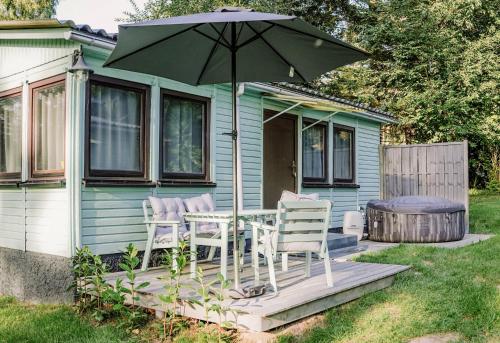 Κήπος έξω από το Ferienhäuser Insel Usedom Waldhaus 2 mit Whirlpool - Direkt am Achterwasser