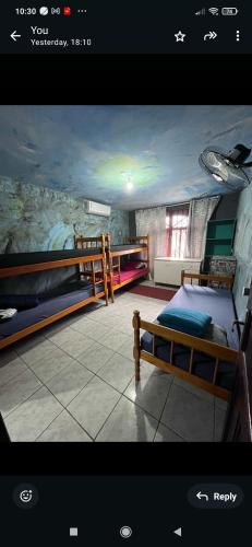 a room with two bunk beds in a room at Hostel Boa Vista in Joinville