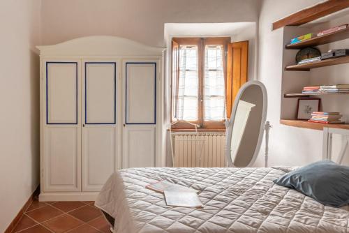 Postel nebo postele na pokoji v ubytování Vivi Palagio nel cuore del Chianti Classico