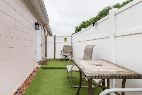 a small patio with a table and chairs at Cozy Private Entry Apt with a Full-Size Kitchen in Orlando