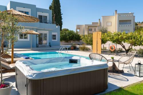a hot tub in the backyard of a villa at Ethria Pool Villa with heated jacuzzi in Afantou