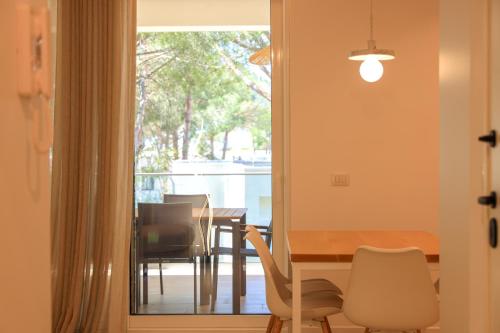 a dining room with a table and chairs at SanPietro Vacation Apartments in Durrës