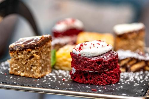 a bunch of different types of desserts on a tray at The Lansdowne, Eastbourne in Eastbourne