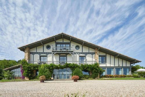 a large white building with a balcony at Villa Askizu by FeelFree Rentals in Getaria