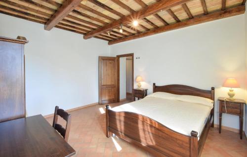 a bedroom with a bed and a dining table at Stunning Home In Spoleto in Spoleto