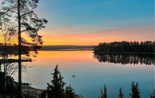 a view of a lake at sunset at Beautiful Home In Årjäng With Lake View in Årjäng