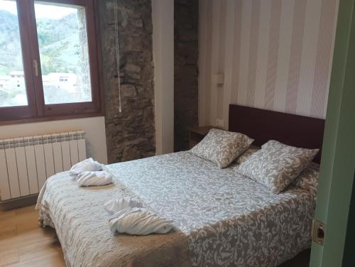 Postel nebo postele na pokoji v ubytování Cal Xesc