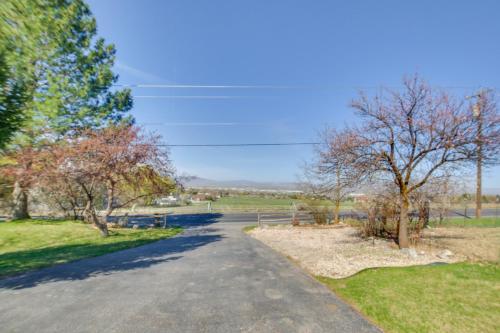 a road with trees on the side of a field at 5 Mi to Downtown Logan Scenic Retreat with Patio in North Logan